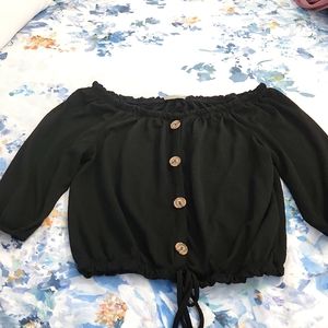 face kisses black off the shoulder top. Very cute. Size M